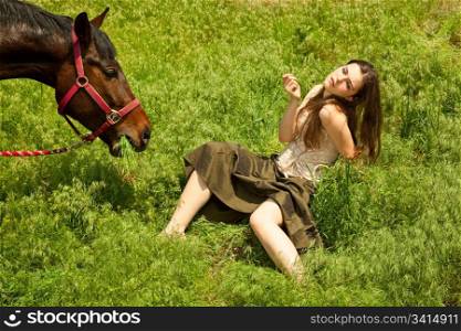 portraite of attractive girl and horse. outdoor shot