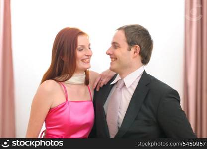 Portraits of formally dressed smiling couple