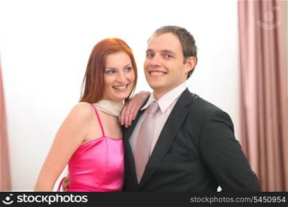 Portraits of formally dressed young couple