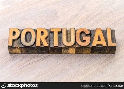 Portugal word in vintage letterpress wood type against grained wood