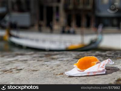 Portuguese delicacy called Ovos Moles made of egg yolks and sugar on the water channel background in Aveiro city, Portugal.. Portuguese delicacy called Ovos Moles made of egg yolks and sugar on the water channel background in Aveiro city, Portugal