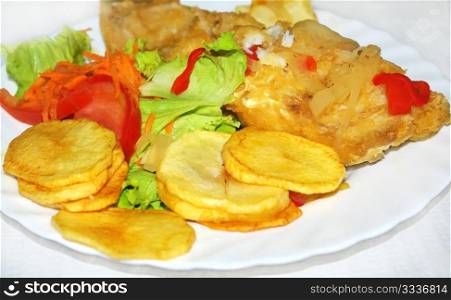 Portuguese plate of salted codfish and salad.