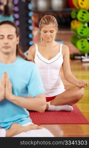 Pose of a lotus performed by two people in sport club