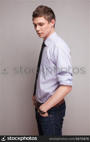 Posing young man model in casual working clothing