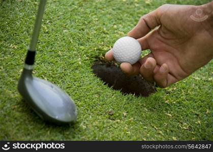Positioning golf ball on tee
