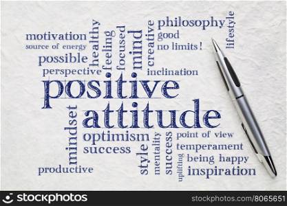 positive attitude word cloud - handwriting on a white lokta paper wit a pen