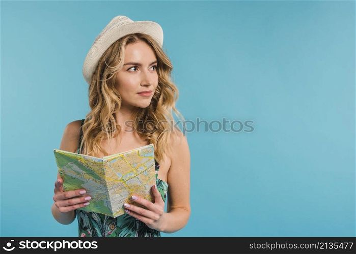 positive attractive young woman hat dress holding map