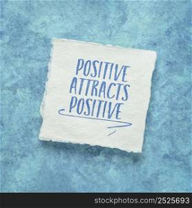 positive attracts positive - law of attraction concept - inspirational note on a handmade paper