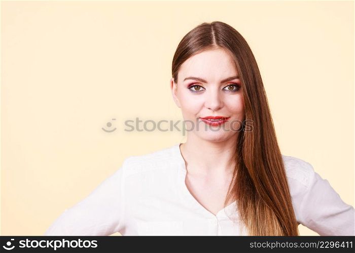 Positive emotions, natural beauty, face expressions concept. Attractive happy smiling woman in brown hair and full makeup. Smiling attractive woman with full makeup