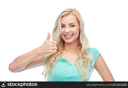 positive gesture and people concept - smiling young woman or teenage girl showing thumbs up. happy woman or teenage girl showing thumbs up