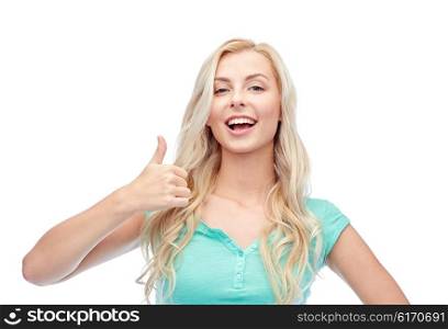 positive gesture and people concept - smiling young woman or teenage girl showing thumbs up. happy woman or teenage girl showing thumbs up
