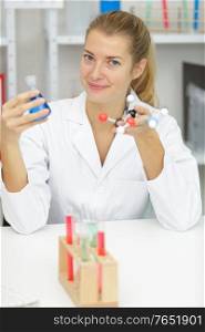 positive minded woman smiling in lab