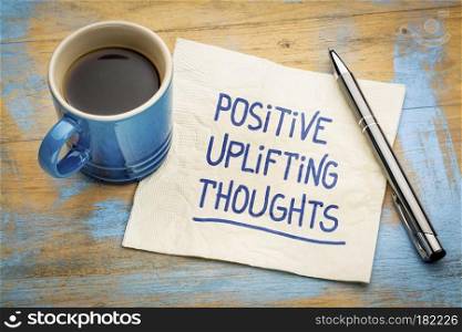 positive, uplifting thoughts - handwriting on a napkin with a cup of espresso coffee