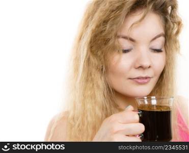 Positive woman holding black coffee about to drink. Getting morning energy, isolated. Positive woman drinking her morning coffee