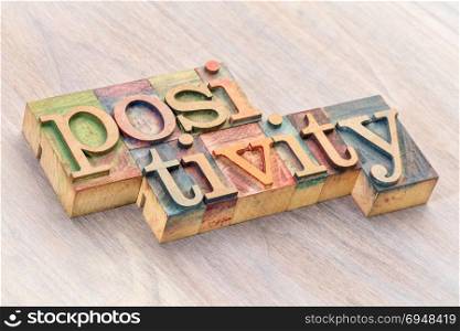 positivity word abstract in letterpress wood type printing blocks
