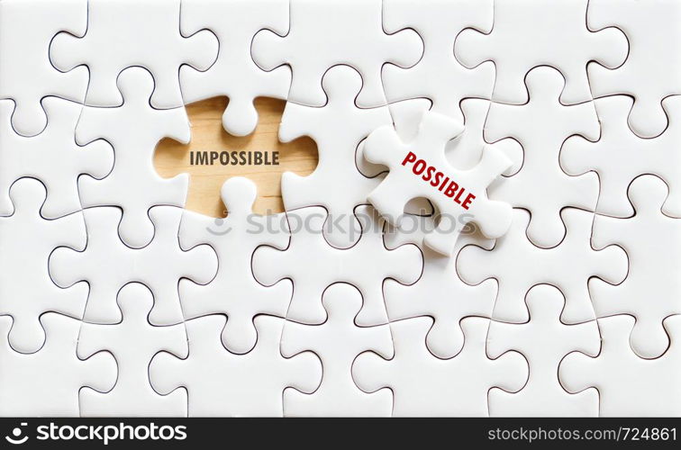 Possible and impossible words on jigsaw puzzle background, business concept, positive thinking, quotation