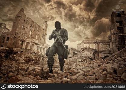Post apocalypse. Sole survivor in tatters and gas mask on the ruins of the destroyed city. Nuclear post apocalypse survivor