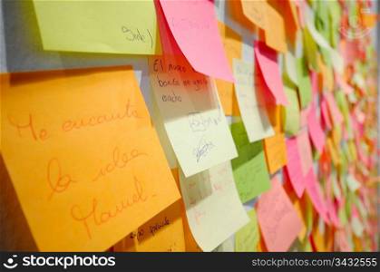 Post-it notes covering a wall