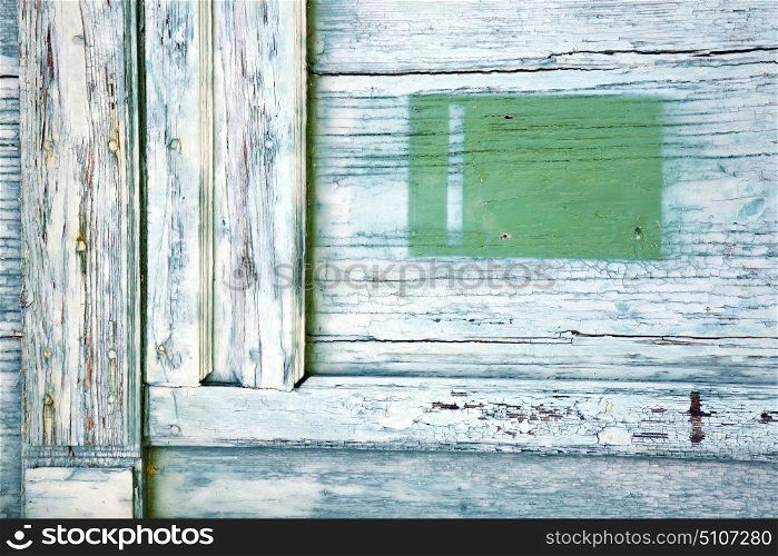 post mail castronno abstract rusty brass brown knocker in a door curch closed wood lombardy italy varese