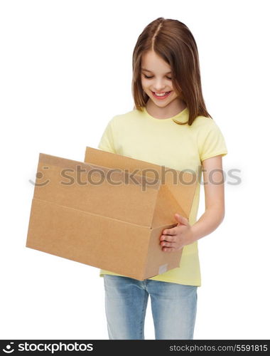 post office, transportation and people concept - smiling little girl looking into open cardboard box