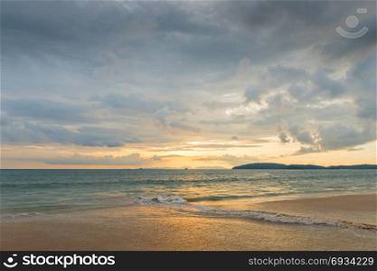 postcard views of the sea and the mountains on the horizon in Thailand in sunset time of day