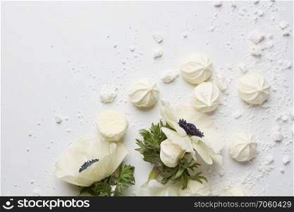 Postcard with white flower and air meringue with place under text isolated on white, flat lay. Postcard with white flower