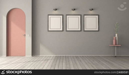 Poster mockup in a empty room with pink arched door and gray walls - 3d rendering. Poster mockup in a empty room with frameless arched door