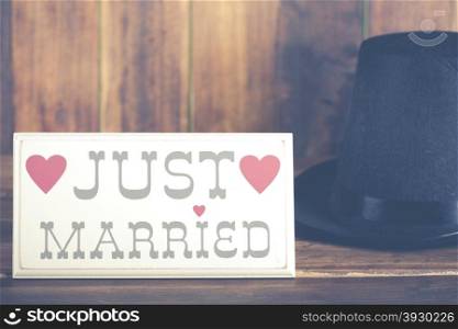 Poster newlyweds with a top hat Groom