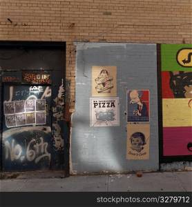 Posters on a wall in Manhattan, New York City, U.S.A.