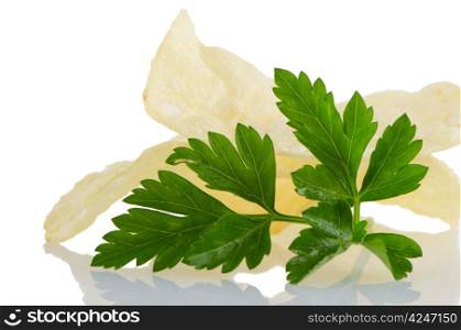 Potato chips and parsley isolated on white background.