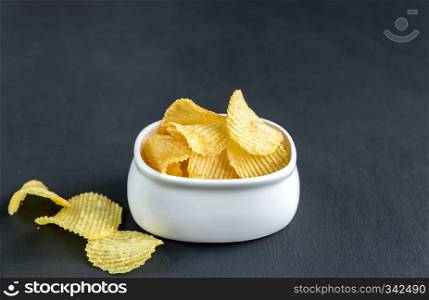 Potato chips in the glass bowl