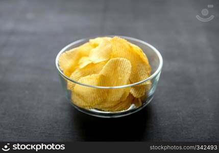 Potato chips in the glass bowl