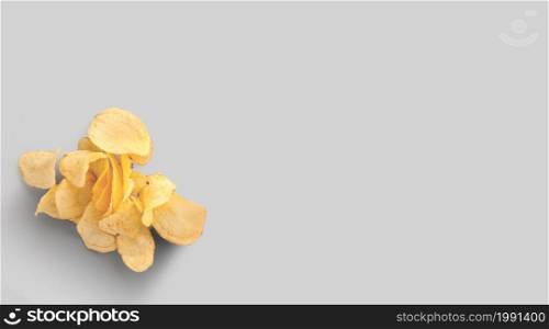 Potato chips isolated on grey background close-up. Top view. Flat lay
