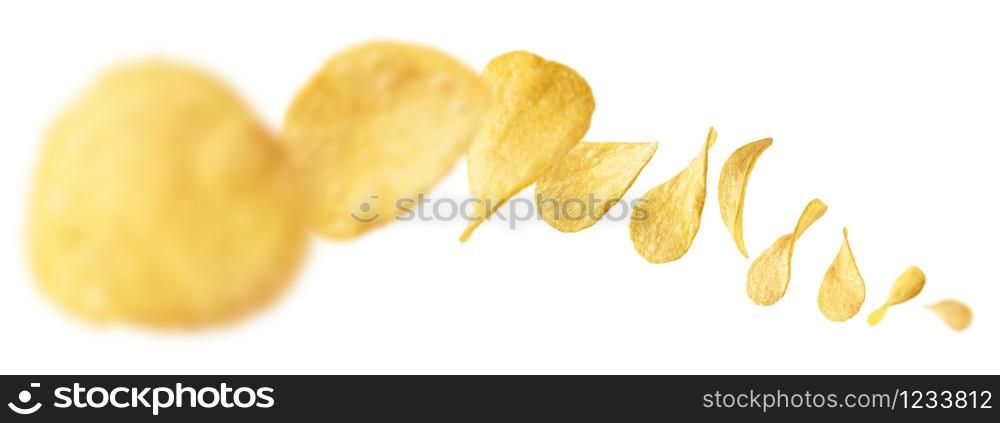Potato chips levitate on a white background.. Potato chips levitate on a white background