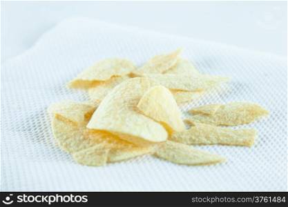 potato chips on tissue in white isolated.white background studio packshot.