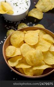 Potato chips with salt and cream dip