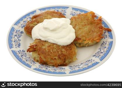 Potato fritters with sour cream