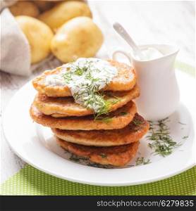 Potato pancakes with sour cream and dill