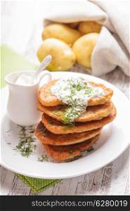 Potato pancakes with sour cream and dill