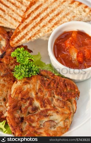 potato pancakes with toast bread and jam closeup