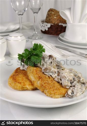 Potato patties (zrazy) with mushrooms and cream sauce