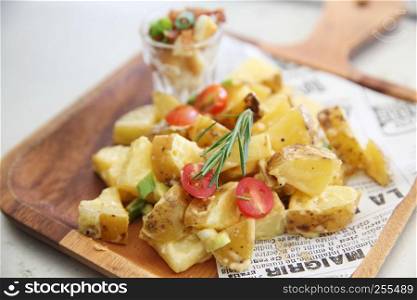 potato salad on wood background