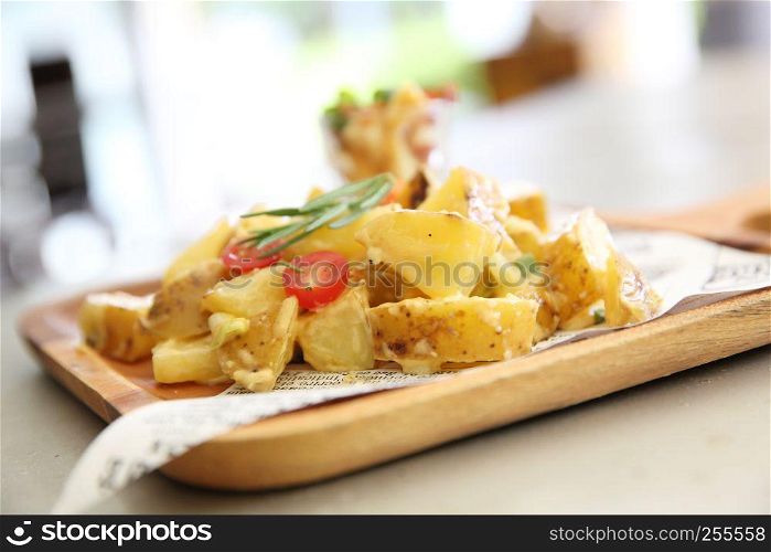 potato salad on wood background