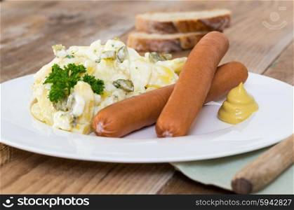 Potato salad with sausage and mustard. Potato salad with sausage and mustard.