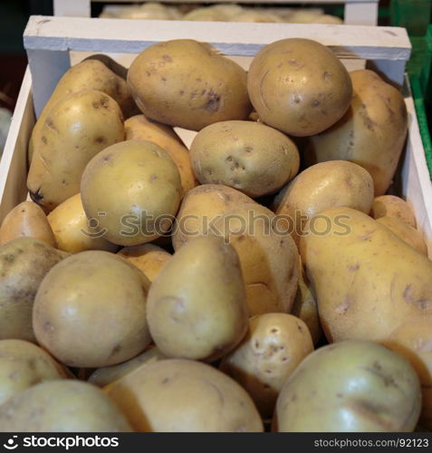 Potatoes inside Wooden Box for Sale in Market