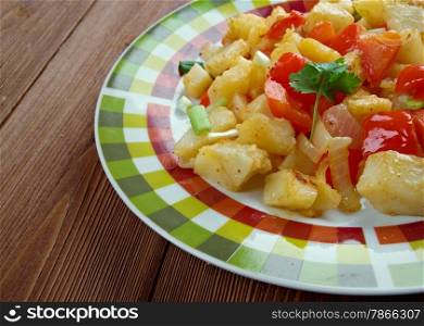 Potatoes O&rsquo;Brien - dish of pan-fried potatoes along with green and red bell peppers.
