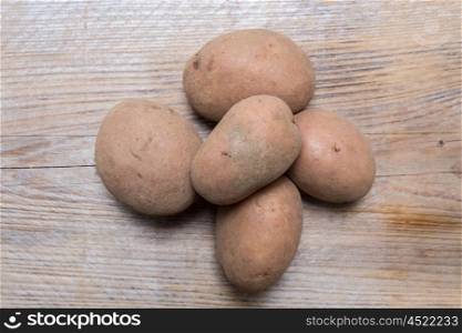 Potatoes on rustic wood Concept. Potatoes on rustic wood Concept.