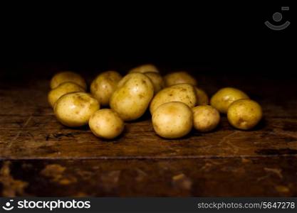 Potatoes on wooden surface