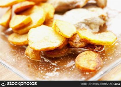 Potatoes over glass plate, shallow depth of field, horizontal image