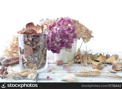 potpourri in a glass jar and bouquet of dry flowers